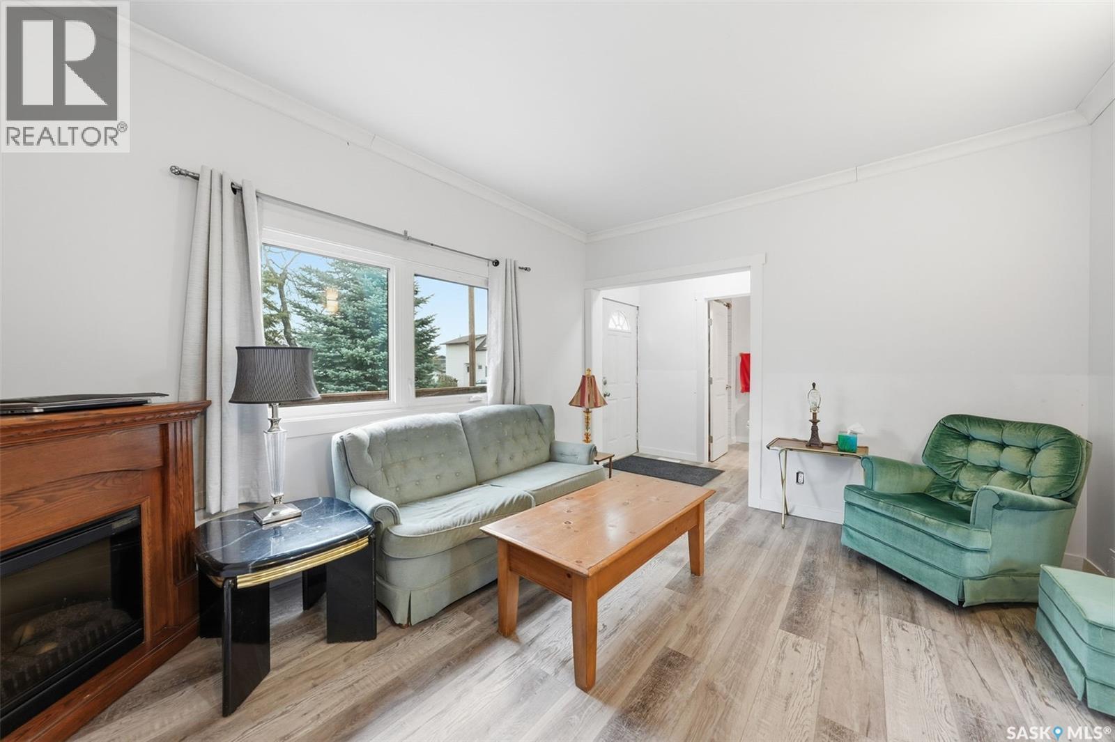 455 Andrew Street, Asquith, SK - Indoor Photo Showing Living Room With Fireplace