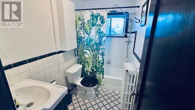 Bathtub with Rain Shower - Main & 2Nd Floors - 457 Mortimer Avenue, Toronto, ON - Indoor Photo Showing Bathroom