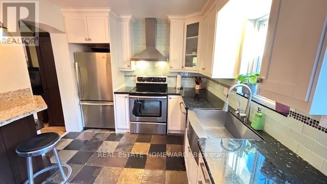 Kitchen - Main & 2Nd Floors - 457 Mortimer Avenue, Toronto, ON - Indoor Photo Showing Kitchen With Stainless Steel Kitchen
