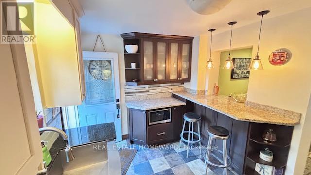 Kitchen with Breakfast Bar - Main & 2Nd Floors - 457 Mortimer Avenue, Toronto, ON - Indoor