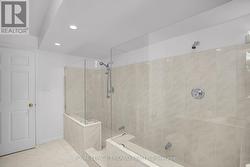 Lower Level: 4-piece Bathroom with Double Showers -