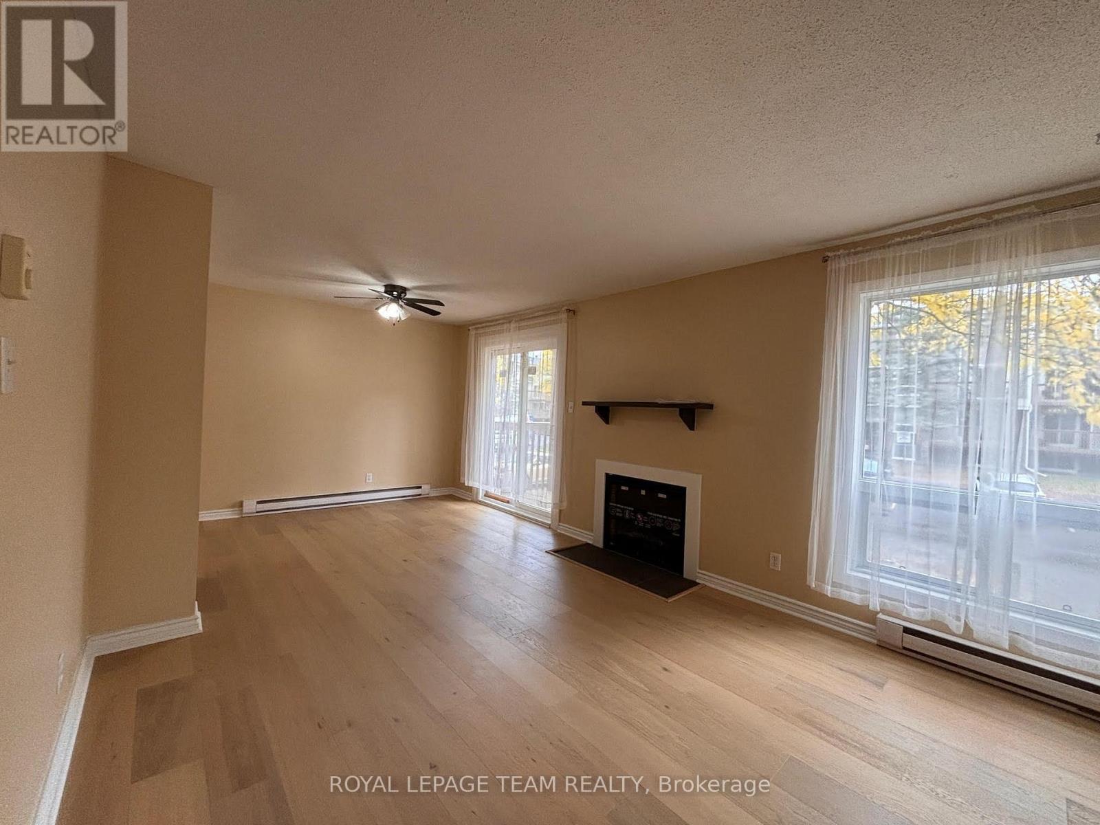 4 - 200 Fenerty Court, Ottawa, ON - Indoor Photo Showing Other Room With Fireplace