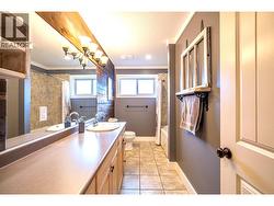 main bathroom with lots of counter space & full bath shower -