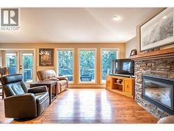 Living room w/gas f/p and large picture windows -