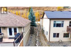 East side of hone with stairs to the back walkout basement -