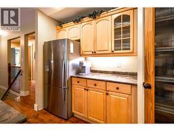 Stainless steel appliances, custom maple cabinets -