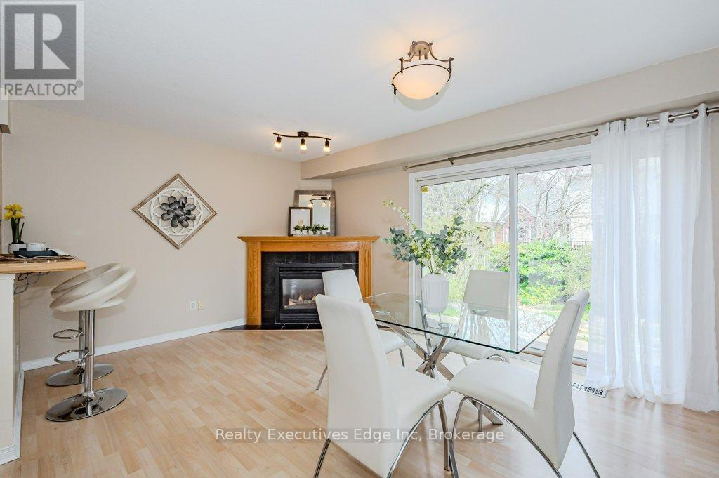 Main - 5 Camm Crescent, Guelph (Pineridge/Westminster Woods), ON - Indoor Photo Showing Dining Room With Fireplace