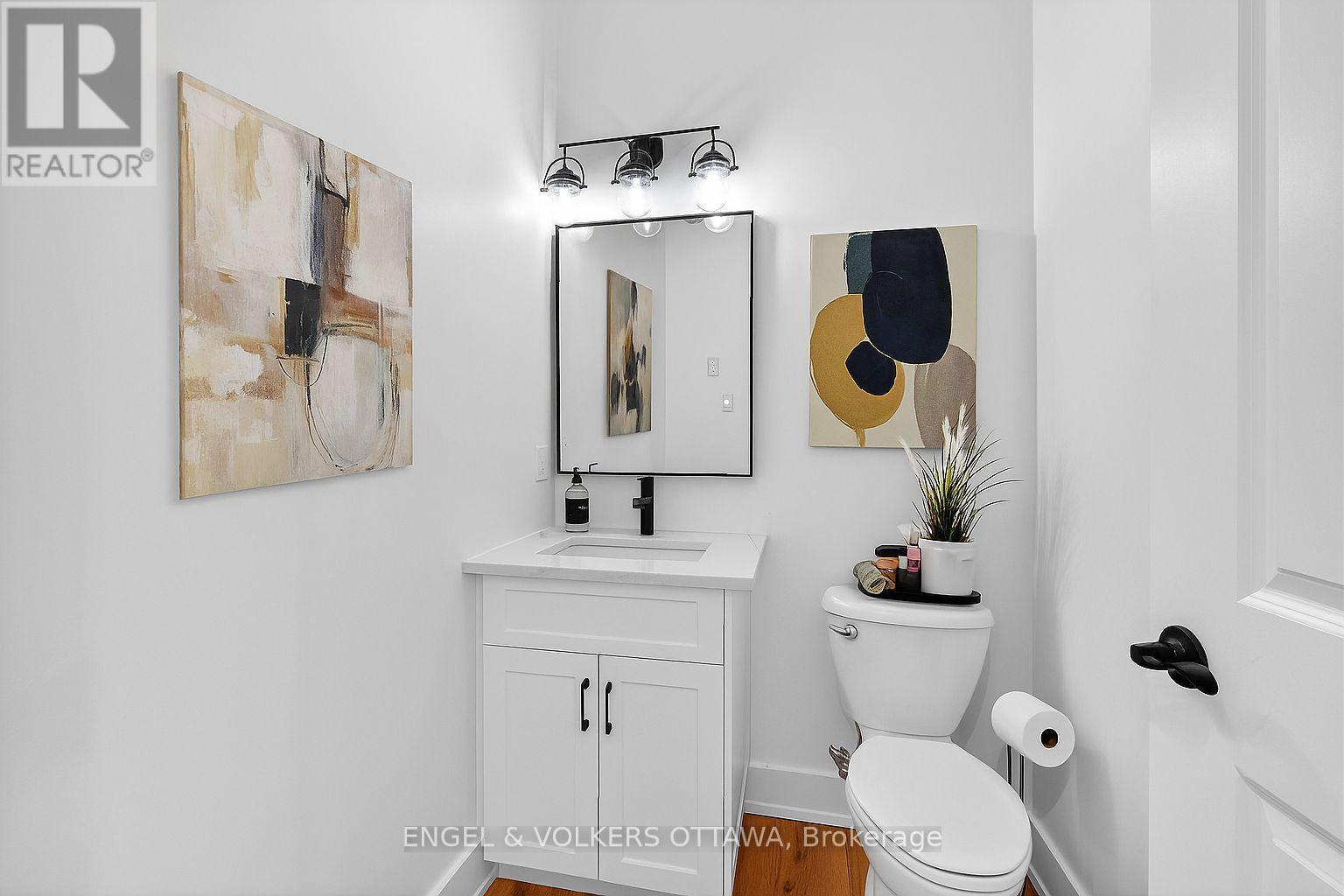 Powder Rm virutally staged with wall art. - 57 Paul A. Bertrand Drive, Mcnab/Braeside, ON - Indoor Photo Showing Bathroom