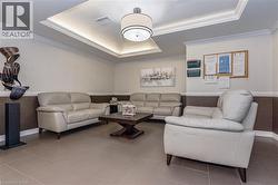 Building lobby featuring crown molding and wainscoting -