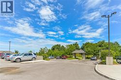 View of asphalt street with curbs and street lighting -
