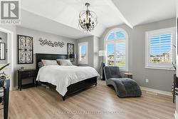 Spacious Primary Suite, abundant natural light. -