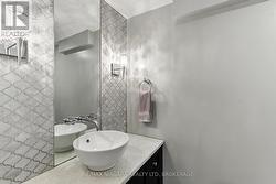 Lower level powder room. -