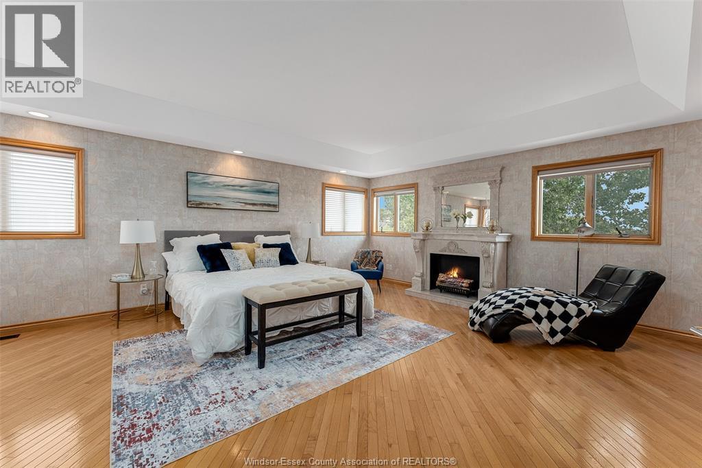 847 Lake Shore Drive, Windsor, ON - Indoor Photo Showing Bedroom With Fireplace