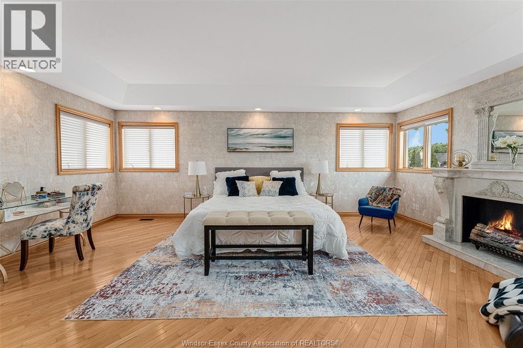 847 Lake Shore Drive, Windsor, ON - Indoor Photo Showing Bedroom With Fireplace