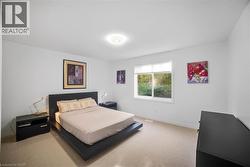 Bedroom with carpet floors and baseboards -