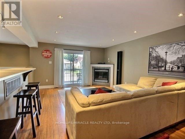 2500 Cobbinshaw Circle, Mississauga, ON - Indoor Photo Showing Living Room With Fireplace