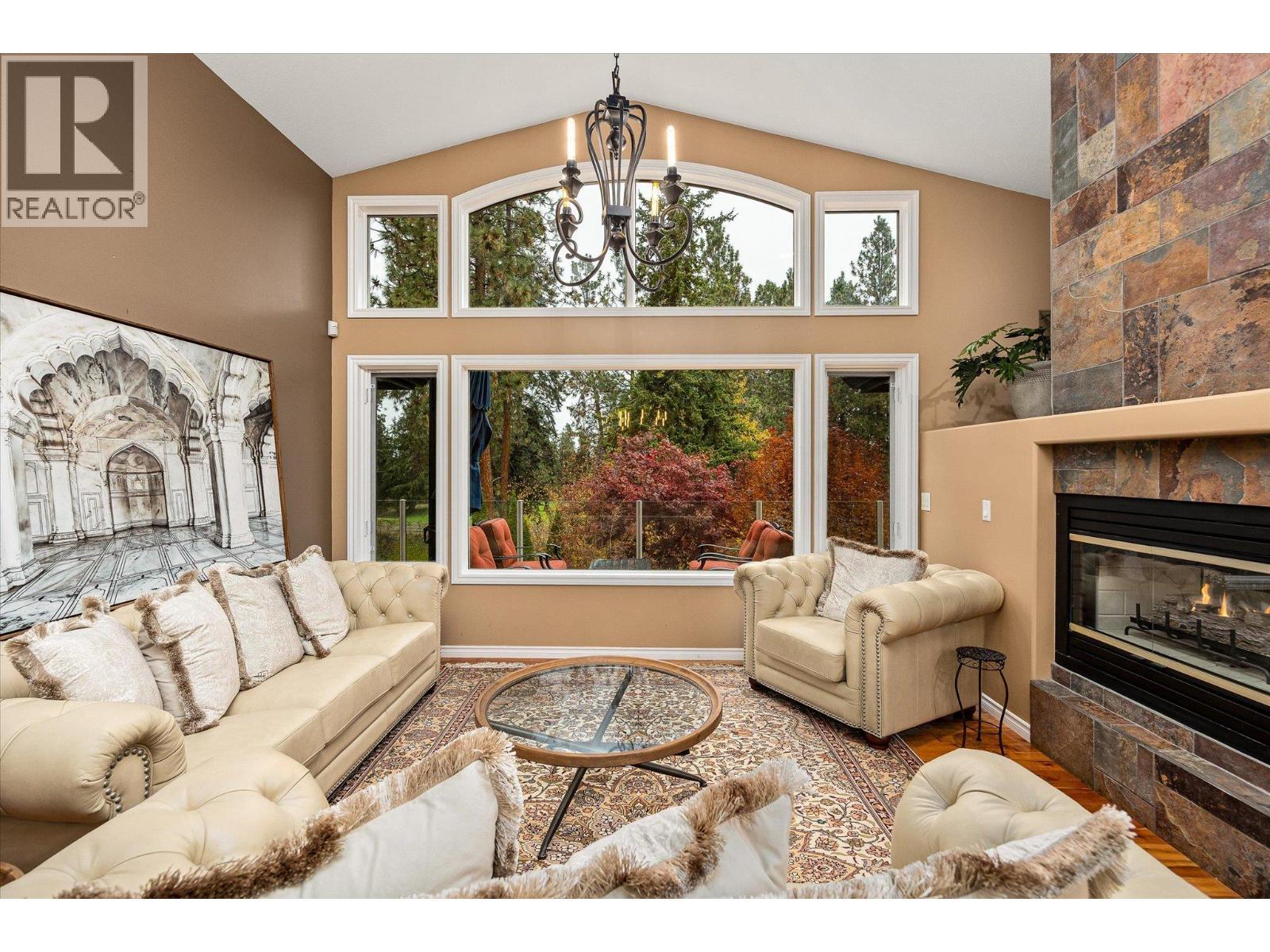 3929 Gallaghers Circle, Kelowna, BC - Indoor Photo Showing Living Room With Fireplace