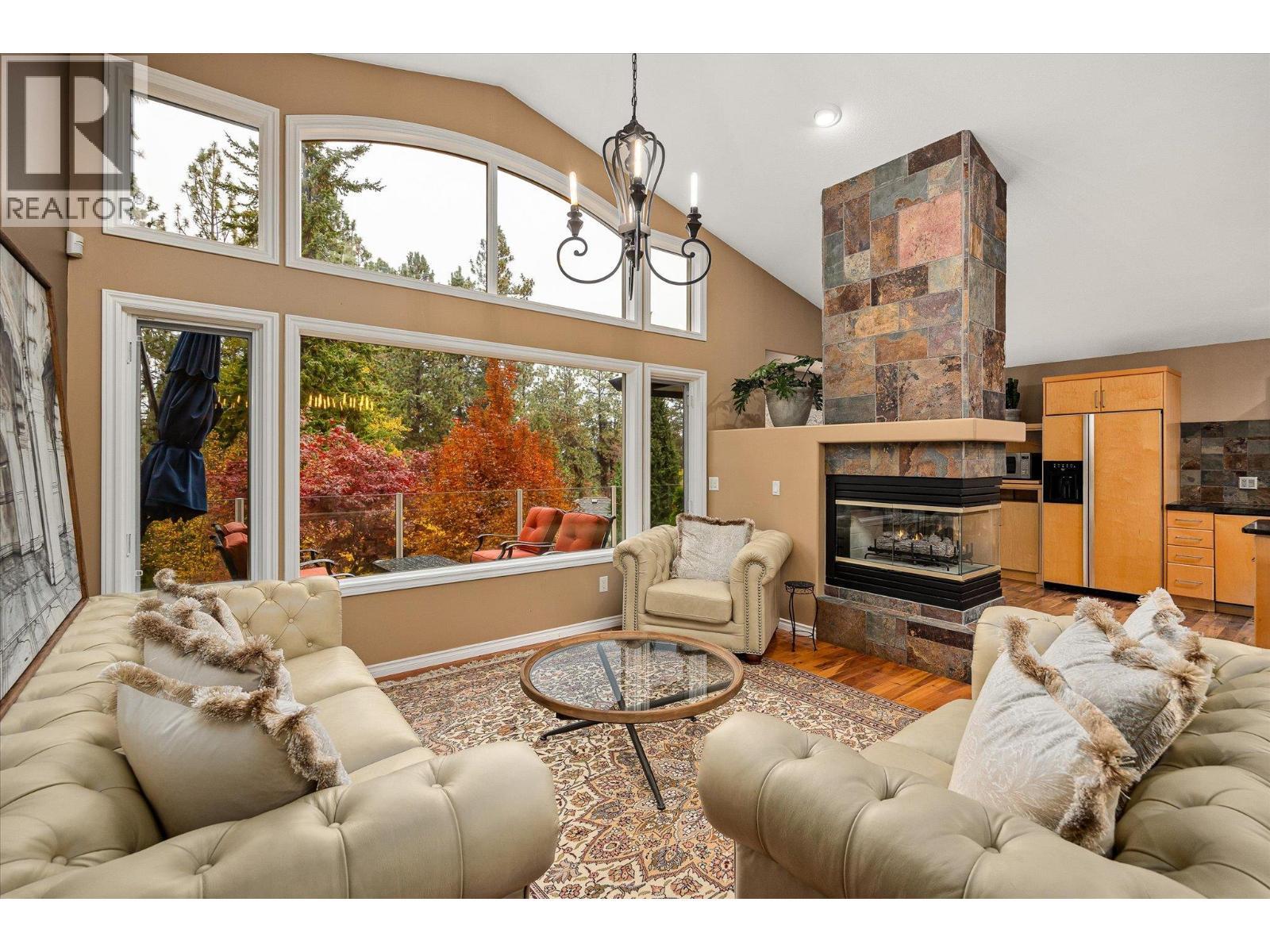 3929 Gallaghers Circle, Kelowna, BC - Indoor Photo Showing Living Room With Fireplace