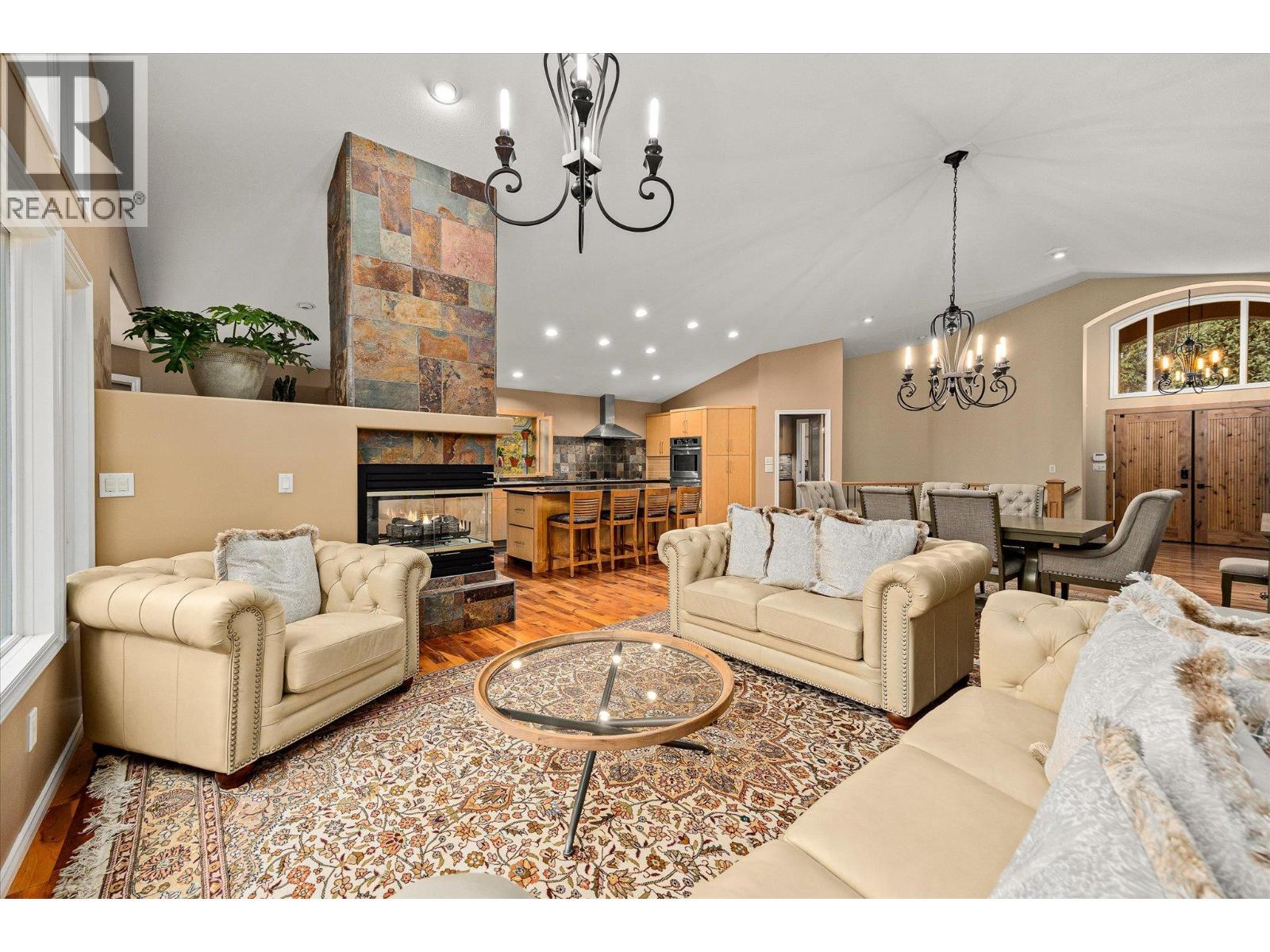 3929 Gallaghers Circle, Kelowna, BC - Indoor Photo Showing Living Room With Fireplace