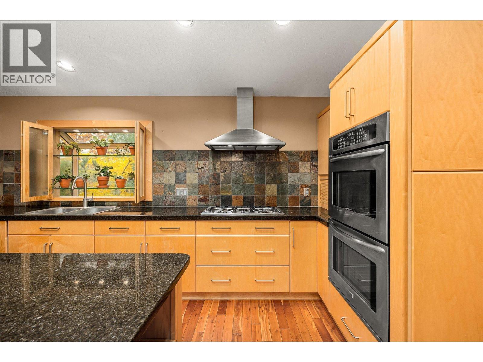 3929 Gallaghers Circle, Kelowna, BC - Indoor Photo Showing Kitchen With Double Sink
