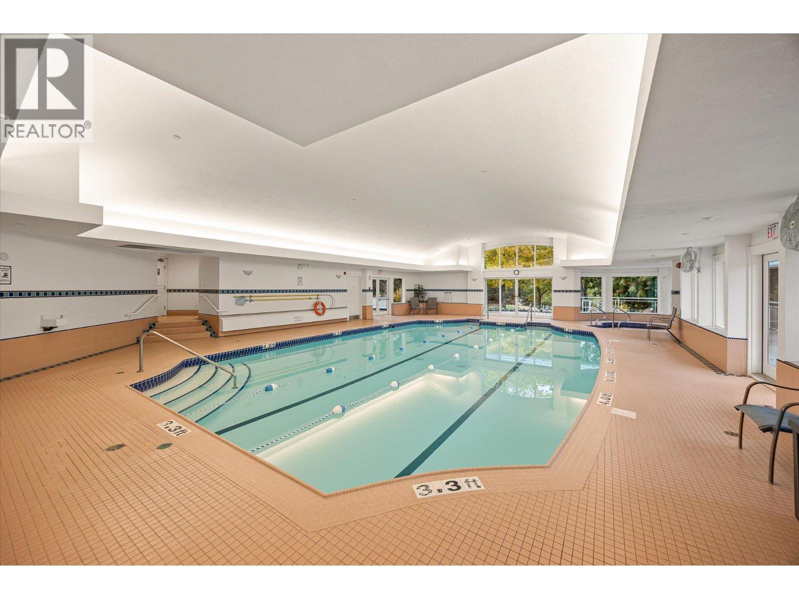 3929 Gallaghers Circle, Kelowna, BC - Indoor Photo Showing Other Room With In Ground Pool