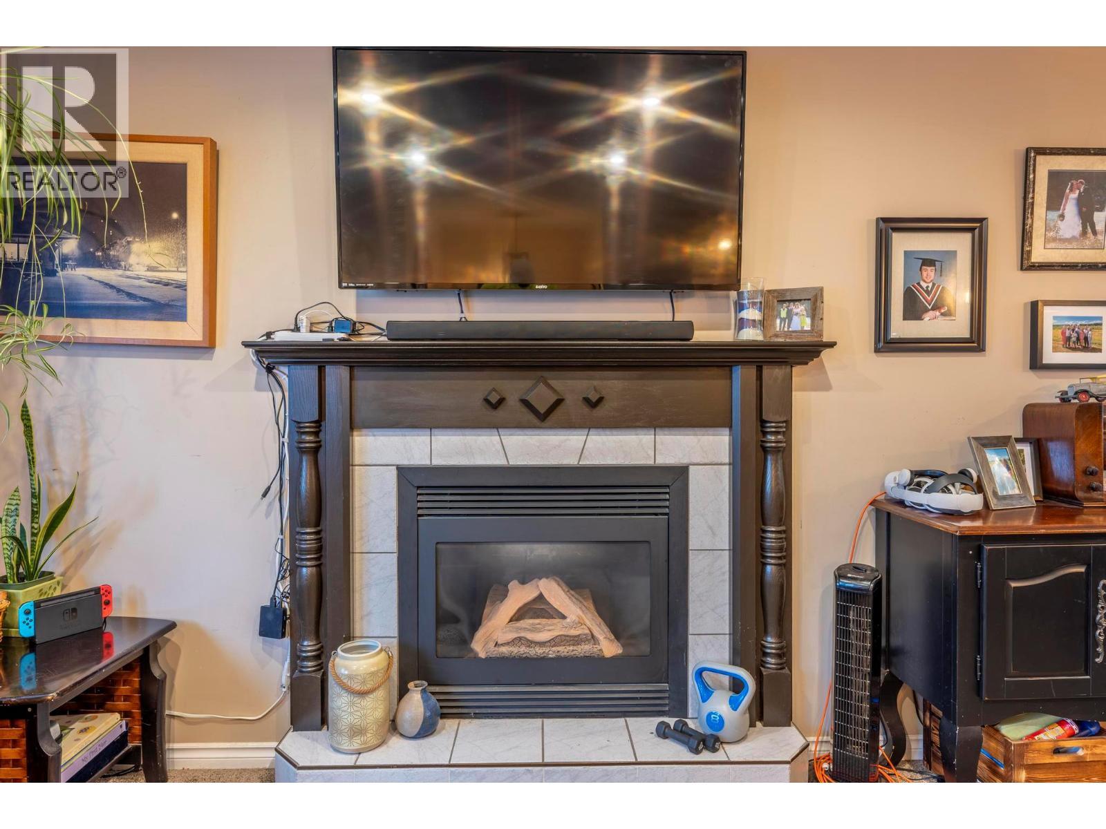 517 12Th Street S, Golden, BC - Indoor Photo Showing Other Room With Fireplace