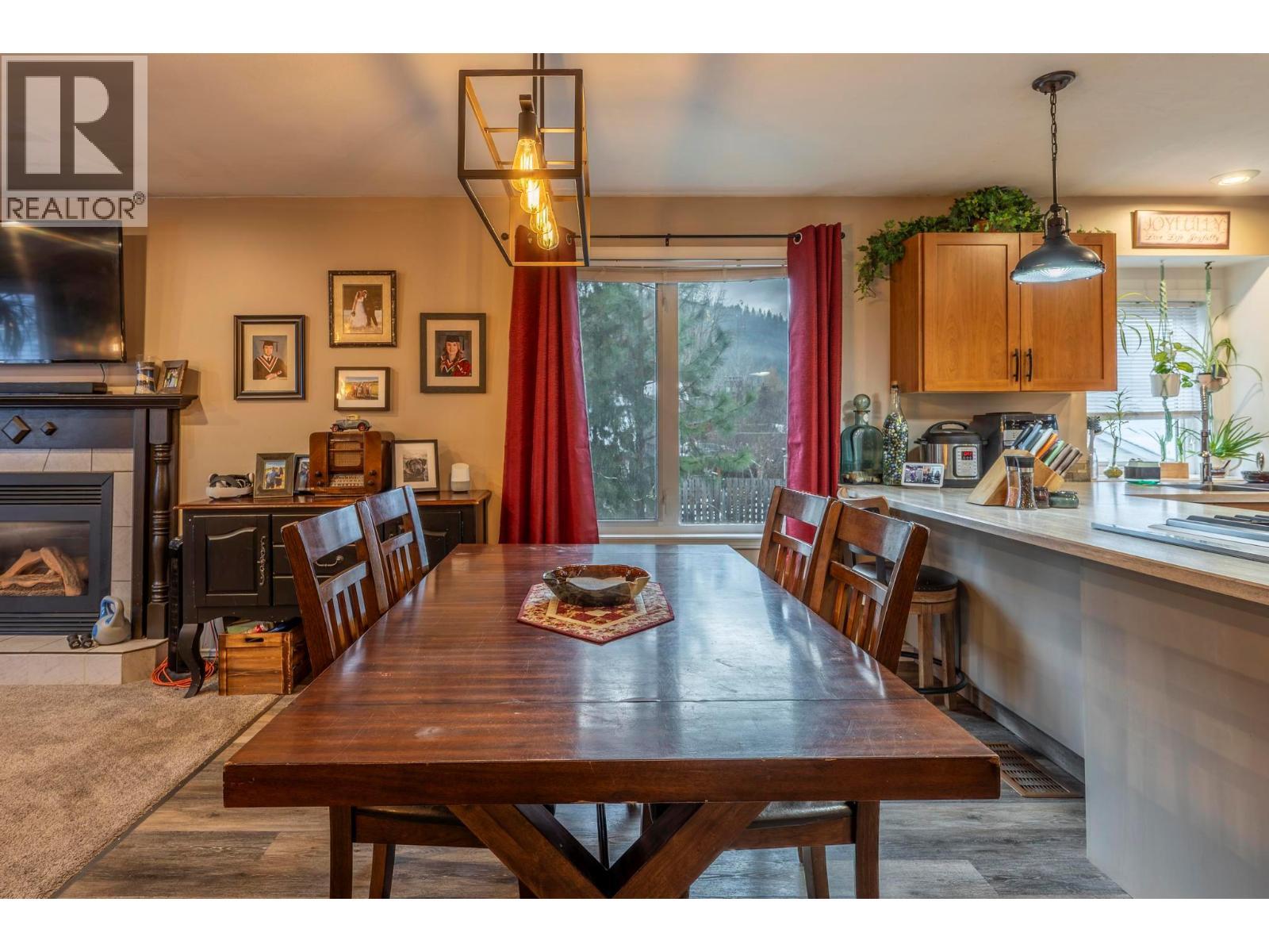 517 12Th Street S, Golden, BC - Indoor Photo Showing Dining Room With Fireplace