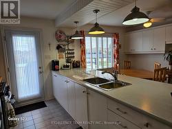 Ample cabinetry. Kit doorleading to rear deck -