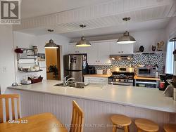 Different angle kitchen view from dining rm. -