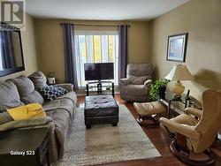 Large living room. Photo taken from dining area. -