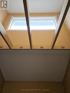 Large bright window above front foyer entrance. -