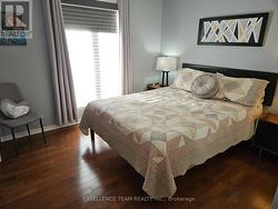 Different angle bdrm photo. Hardwood floor -