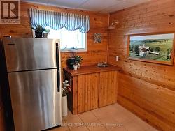 Small bar sink and counter in exercise room. -