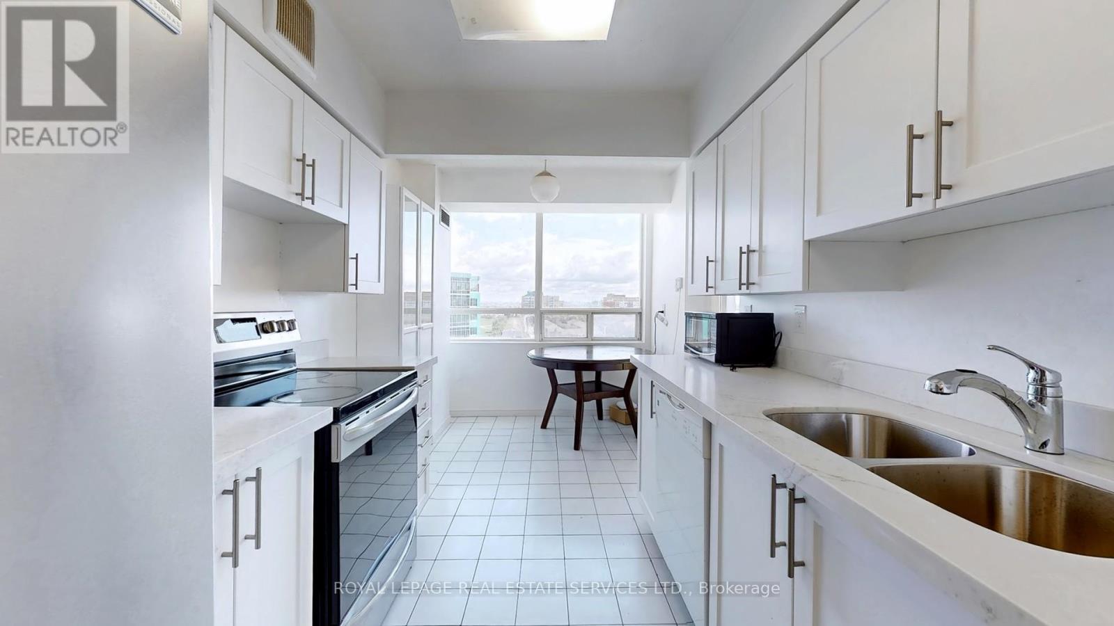 1111 - 50 Kingsbridge Garden, Mississauga, ON - Indoor Photo Showing Kitchen With Double Sink