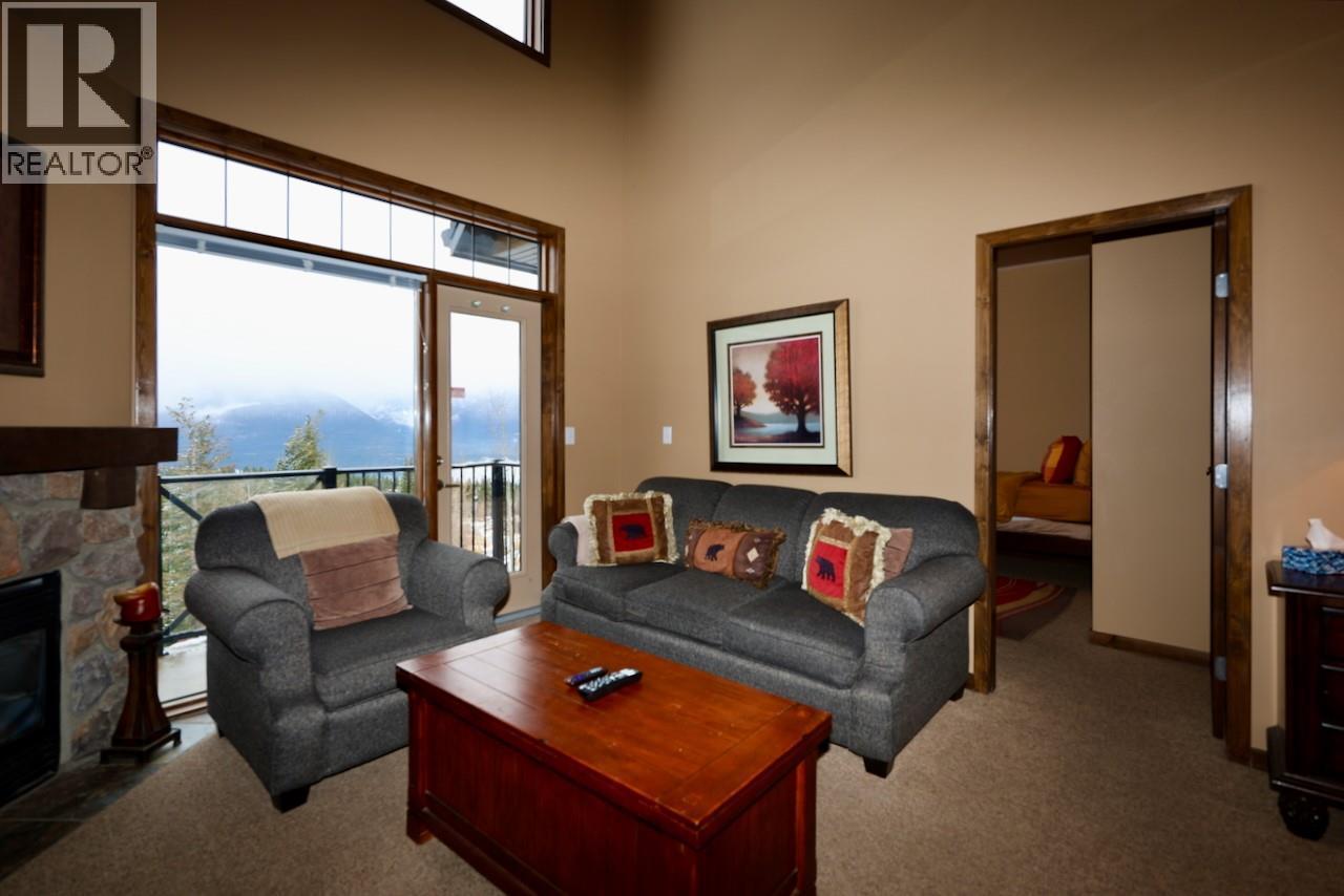 1549 Kicking Horse Trail Unit# 415 (A&B), Golden, BC - Indoor Photo Showing Living Room With Fireplace