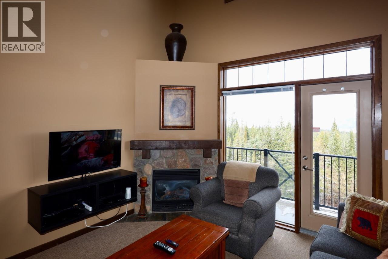 1549 Kicking Horse Trail Unit# 415 (A&B), Golden, BC - Indoor Photo Showing Living Room With Fireplace
