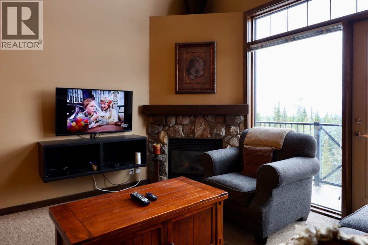 1549 Kicking Horse Trail Unit# 415 (A&B), Golden, BC - Indoor With Fireplace