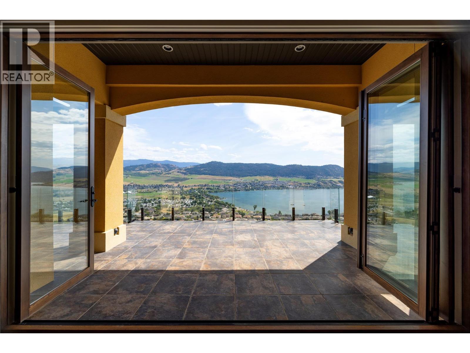 10"" Nano Doors Open Seamlessly to the Main Floor Patio - 108 Vineyard Way, Vernon, BC - With Body Of Water With View With Exterior