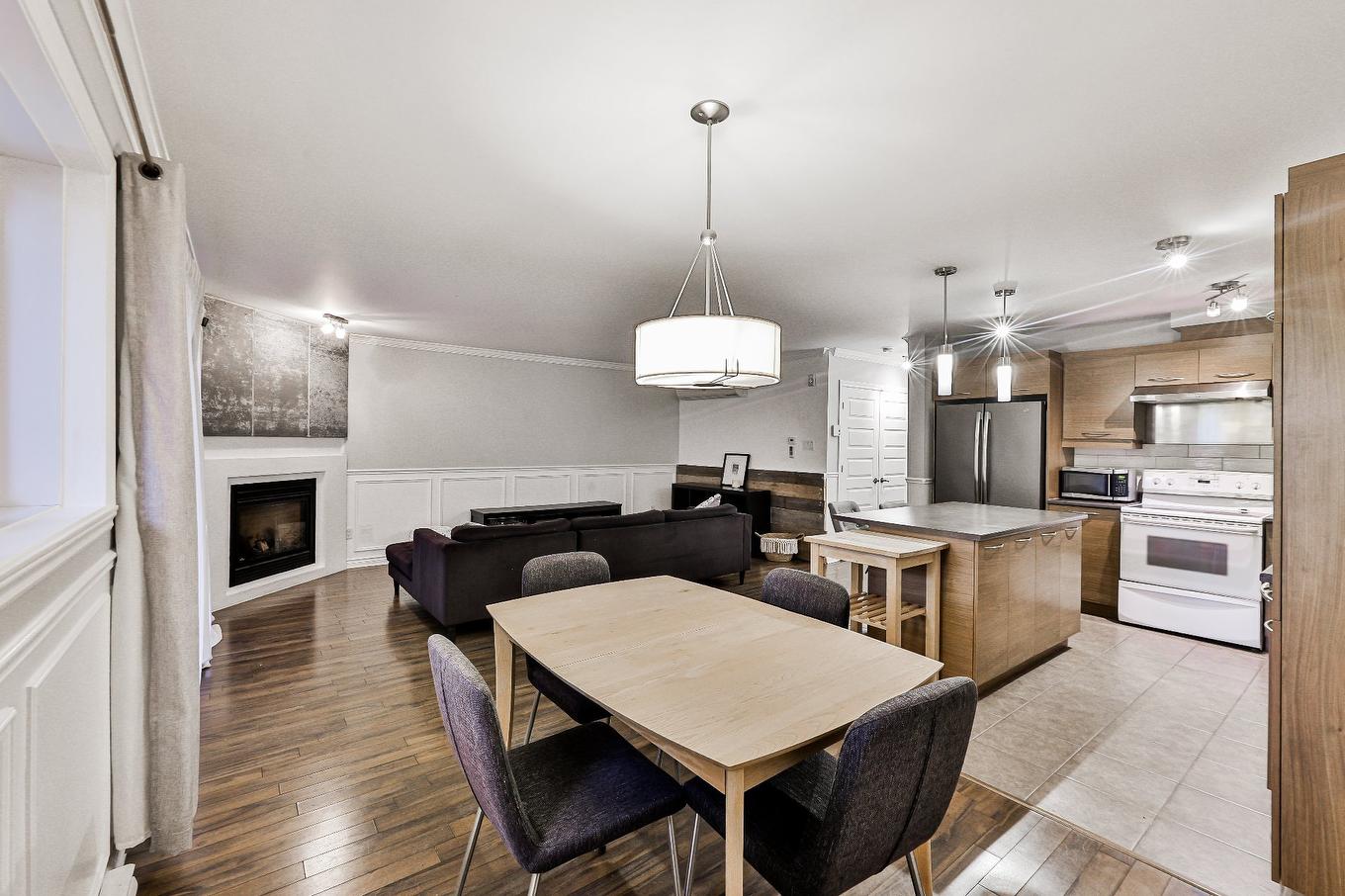 Overall view - 103-2405 Rue Versailles, Mascouche, QC - Indoor With Fireplace