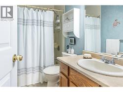 MAIN BATHROOM - Full main bath with tub/shower, large vanity. -