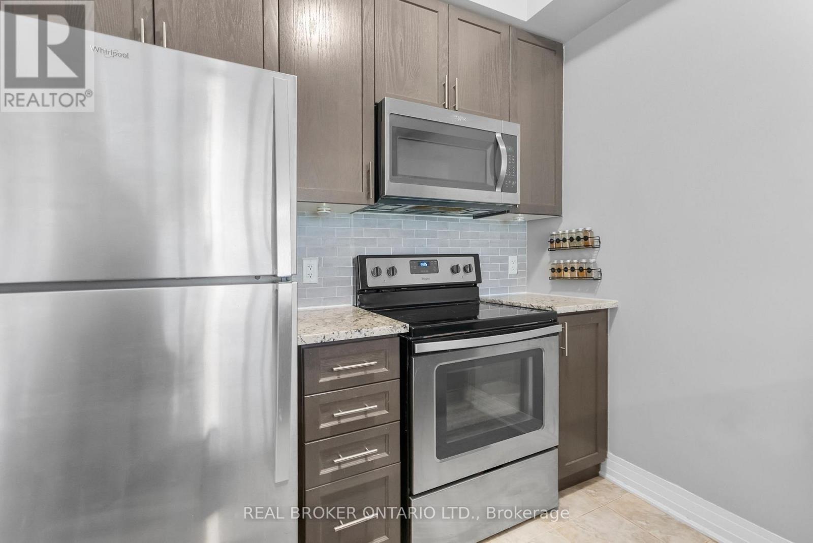 110 - 10 Concord Place W, Grimsby, ON - Indoor Photo Showing Kitchen With Stainless Steel Kitchen