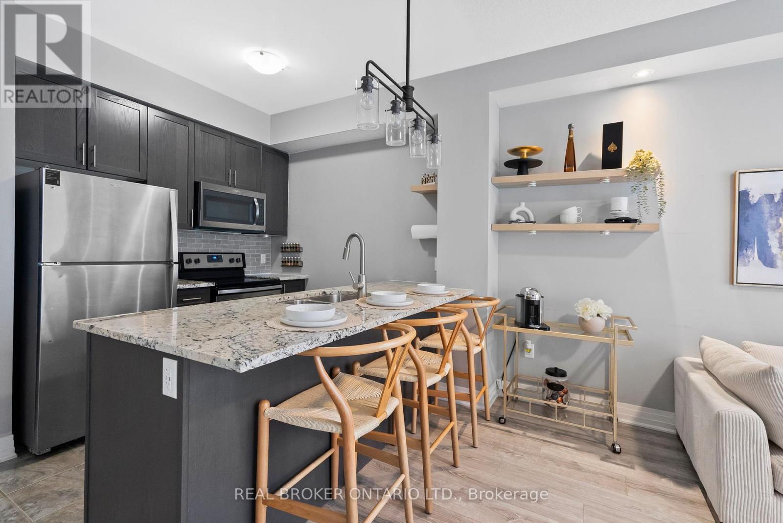 110 - 10 Concord Place W, Grimsby, ON - Indoor Photo Showing Kitchen With Stainless Steel Kitchen