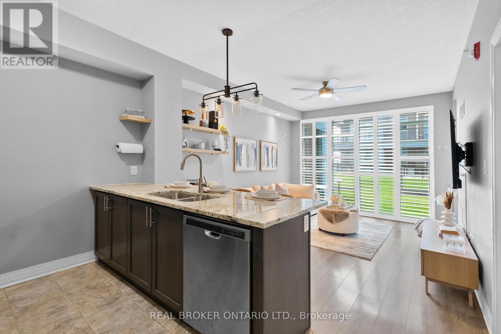 110 - 10 Concord Place W, Grimsby, ON - Indoor Photo Showing Kitchen With Double Sink
