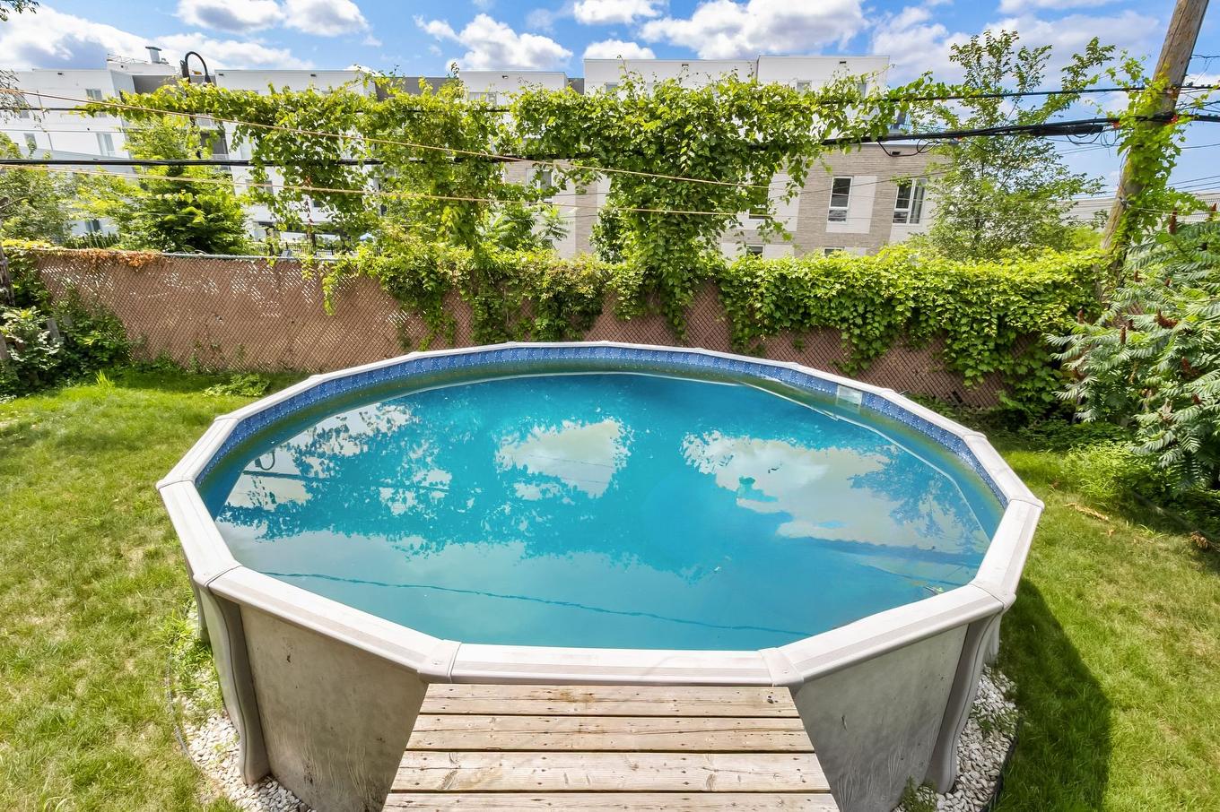 Piscine - 2010 Rue Mayfield, Laval (Chomedey), QC - Outdoor With Above Ground Pool With Backyard