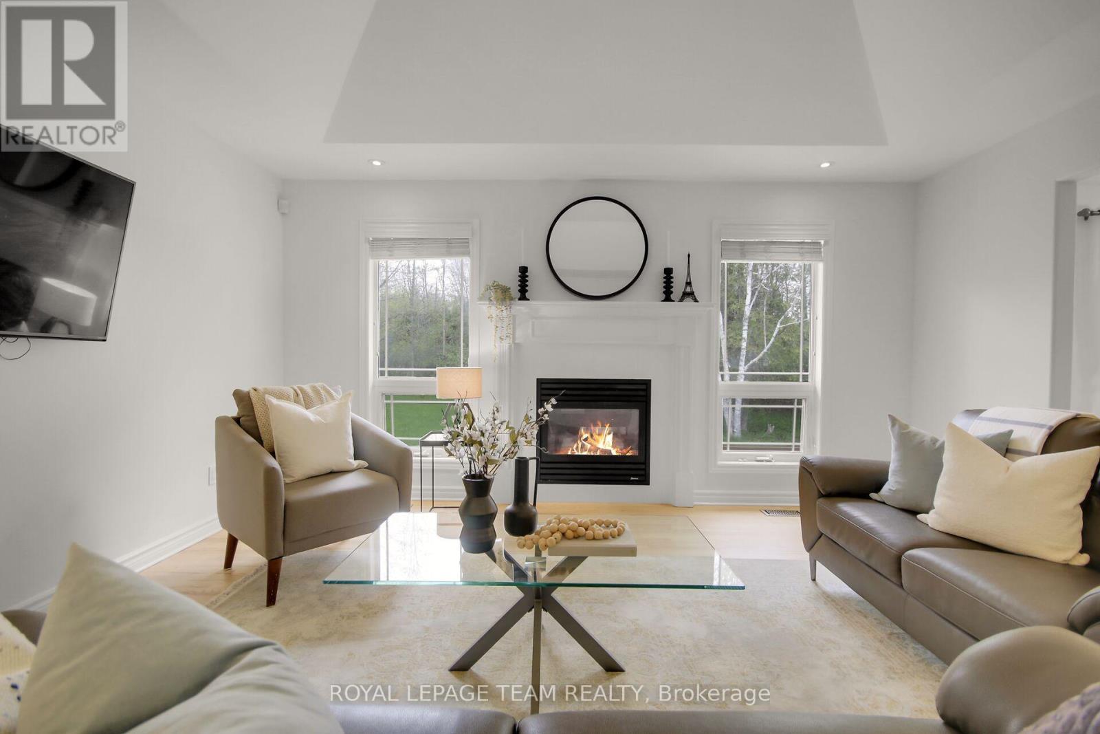 5719 Stuewe Drive, Ottawa, ON - Indoor Photo Showing Living Room With Fireplace