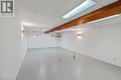 Basement featuring a drop ceiling -