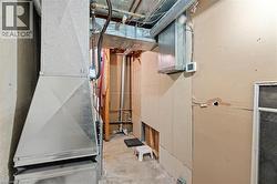 Unfinished below grade area with heating unit -