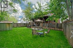 View of yard featuring an outdoor fire pit -