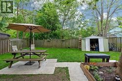 View of yard with outdoor dining space and a patio area -