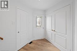 Entryway featuring light wood finished floors -